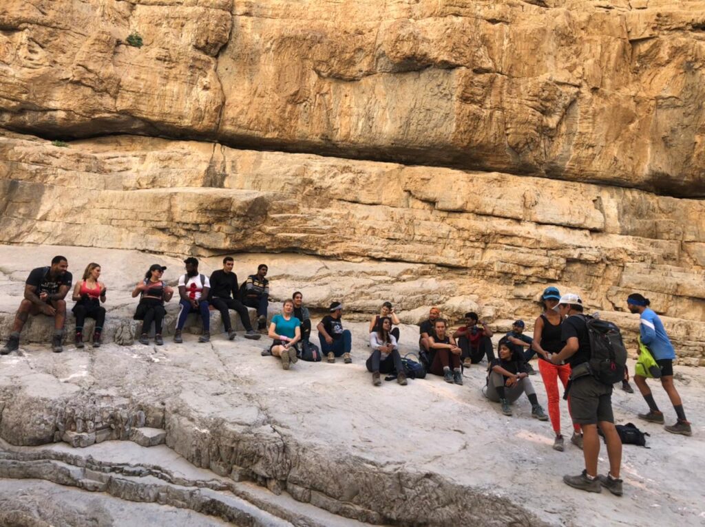 Exploring the Red Wall hiking route in Wadi Naqab, Ras Al Khaimah, with Alpine Trekkers UAE.